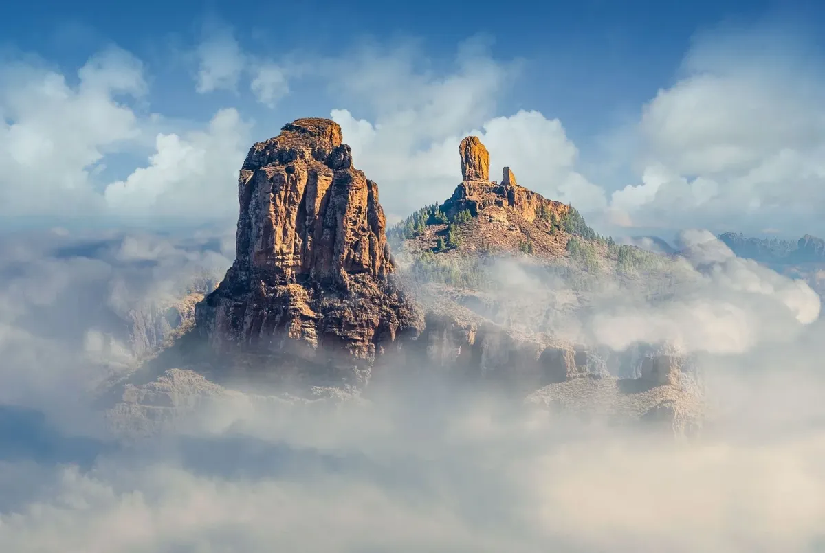 Roque Bentayga and Roque Nublo rising above the clouds, Gran Canaria