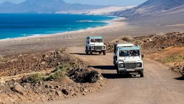 Off-road jeep safari excursion crossing a coastal track in the Canary Islands