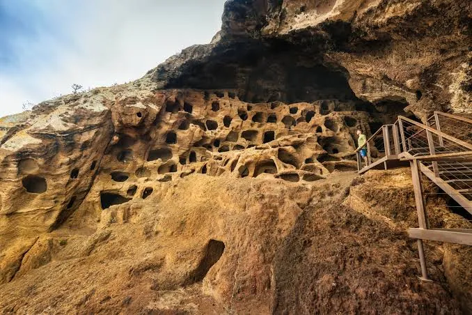 Hundreds of carved granary chambers in the cliff at the Cenobio de Valerón