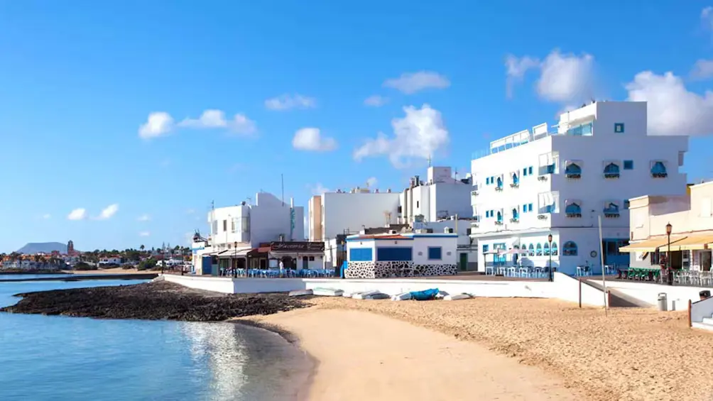 Whitewashed seafront and beach in Corralejo, Fuerteventura