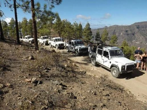 Off-road jeep safari convoy driving through the mountainous interior of Gran Canaria
