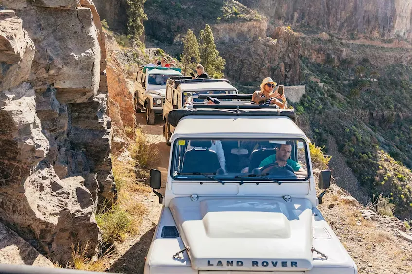 Land Rover jeeps on a mountain track in the interior of Gran Canaria