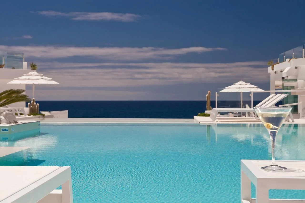 Infinity pool overlooking the ocean at Lani's Suites de Luxe in Puerto del Carmen, Lanzarote