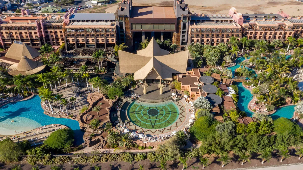 Aerial view of the African-themed architecture and lagoon pools at Lopesan Baobab Resort, Meloneras