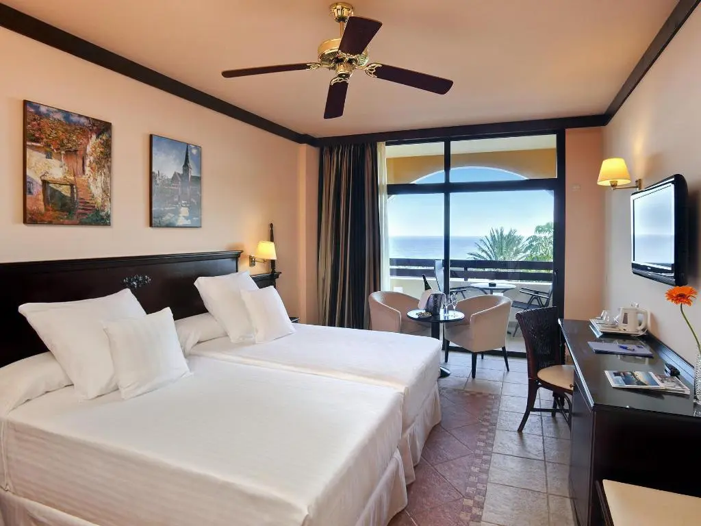 Twin bedroom with sea-view balcony at Occidental Jandía Royal Level in Morro Jable, Fuerteventura