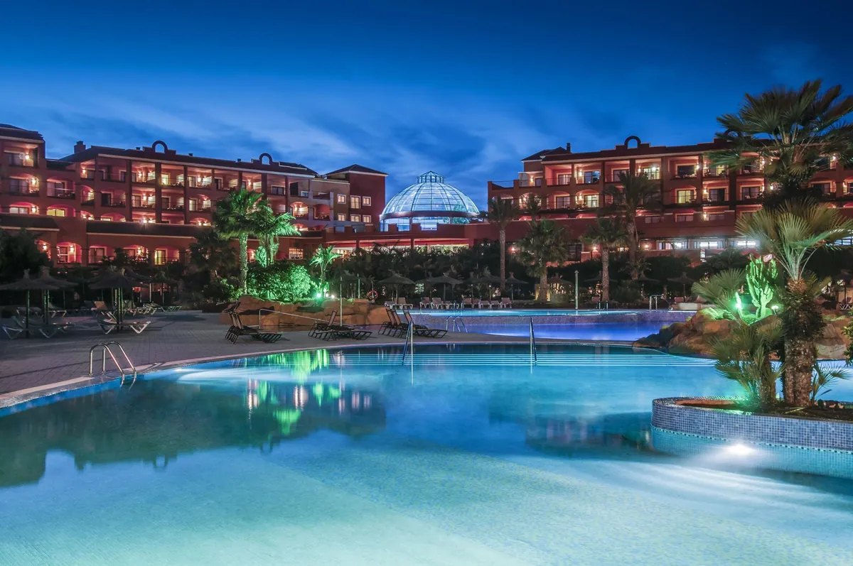 Pool and illuminated buildings at night at Sheraton Fuerteventura Beach, Golf & Spa Resort, Caleta de Fuste