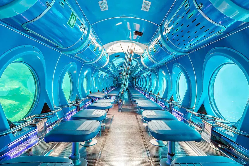 Interior of the passenger submarine in Puerto de Mogán, with large portholes